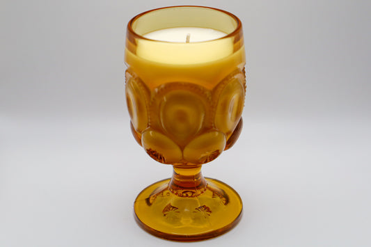 Moon & Stars Amber Water Goblet with Cedar and Amber scented soy candle.