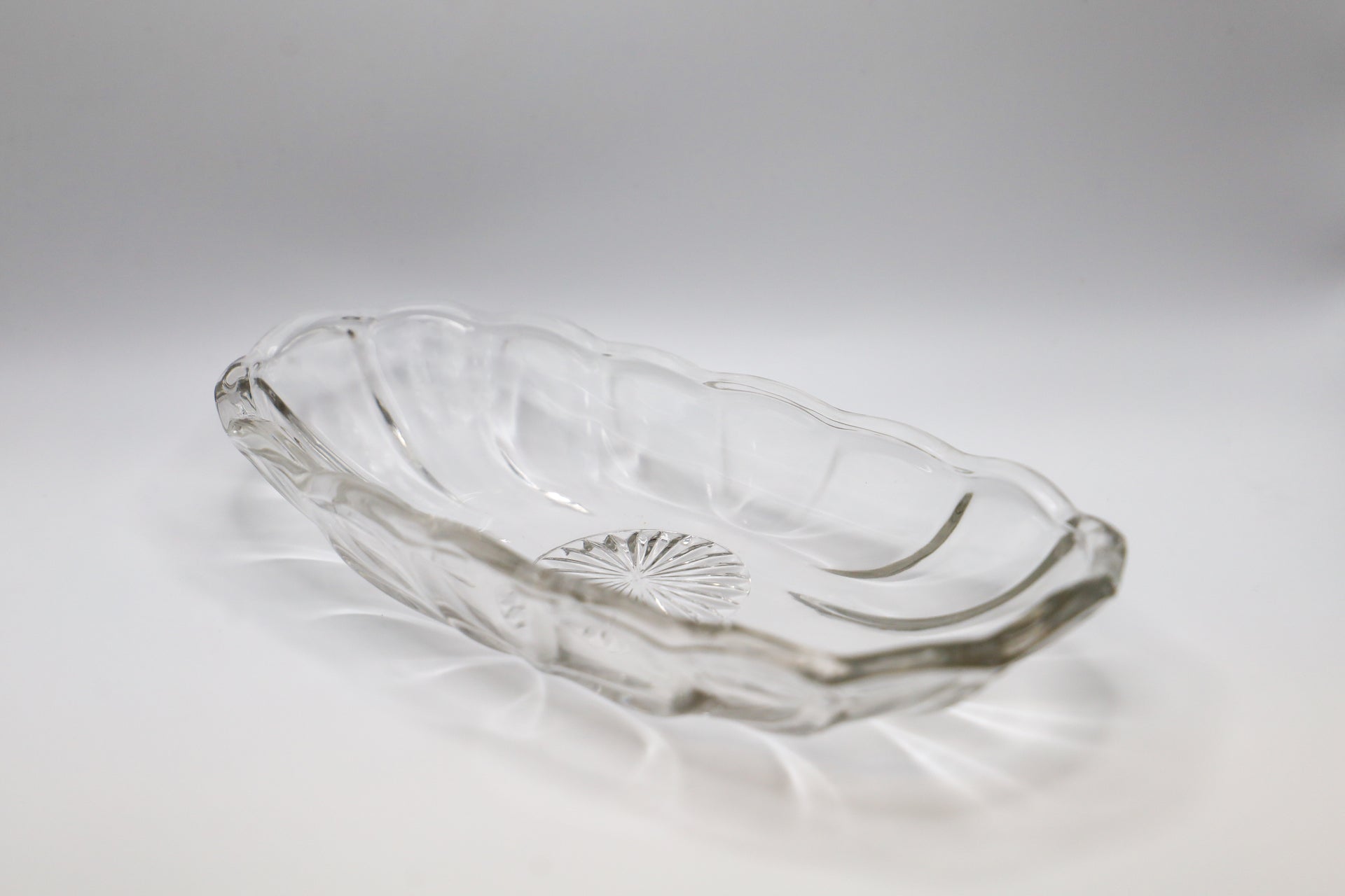Clear Banana Boat dish with scalloped edges