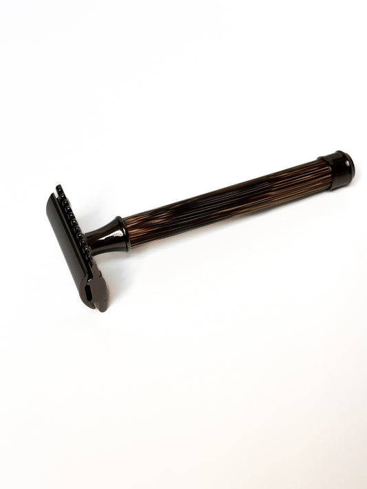 Bamboo razor with stainless steel metal, white background