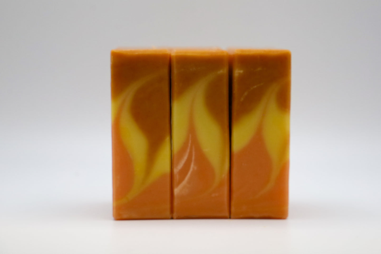 Bonfire scented soap with orange yellow swirled flame patten