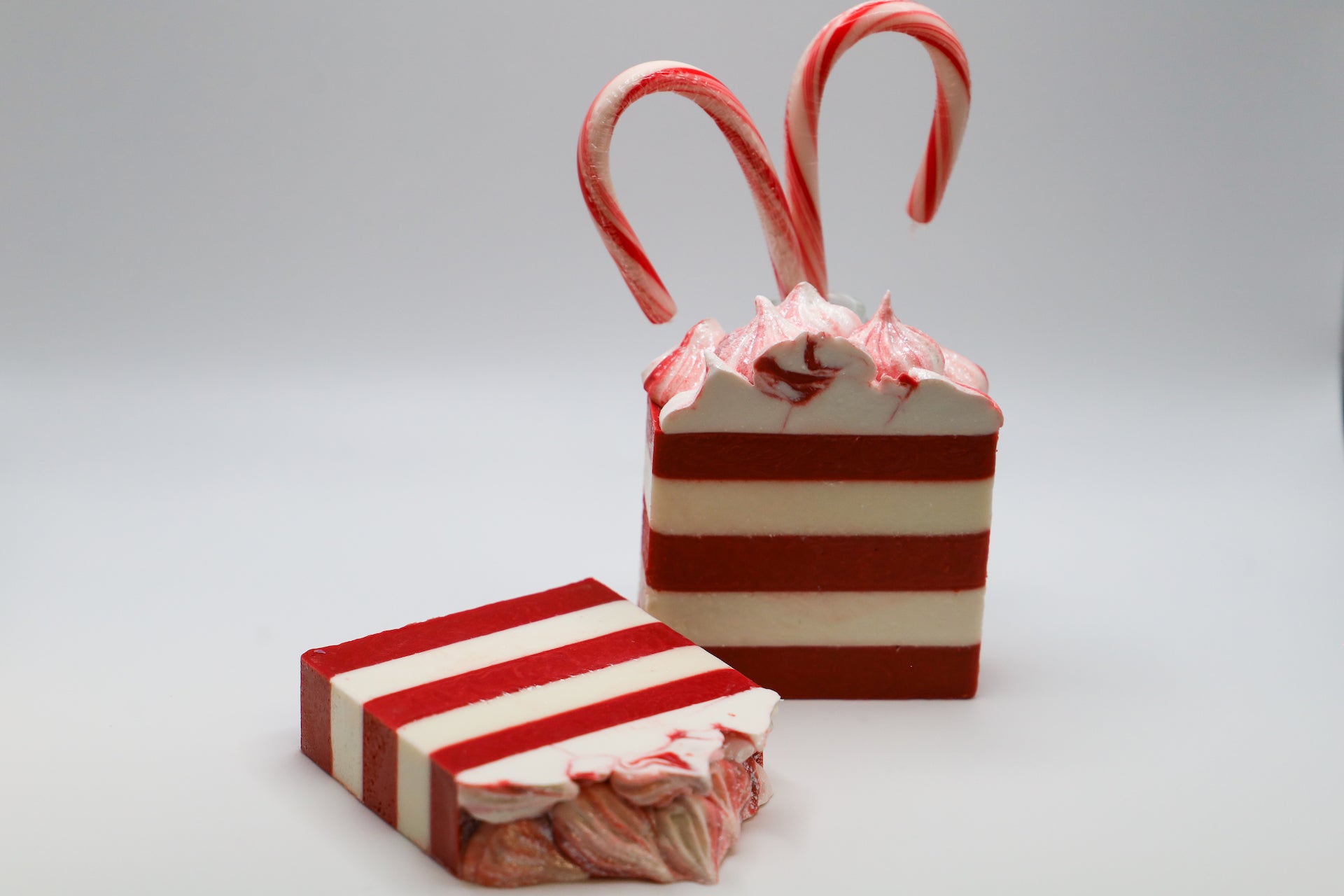 Large red and white striped bar with frosted top, scented in candy cane.