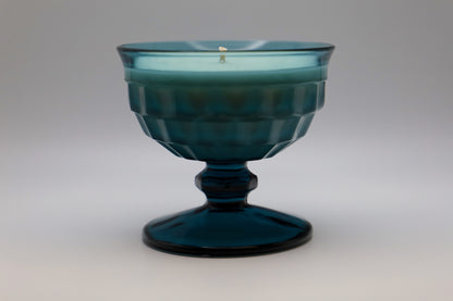 Whitehall Riviera Blue Sherbet dish in a beautiful deep blue, with Galactic Skies scented soy candle.