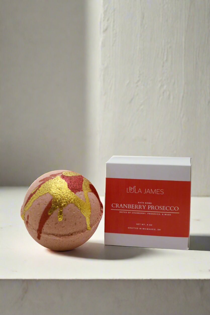 Decorative bath bomb with gold and red paint