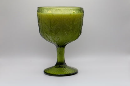 Green glass container with oak leaf pattern and coconut lime or apricot grove scented candle