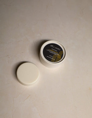 Shave Butter Bar sitting next to the packaging.