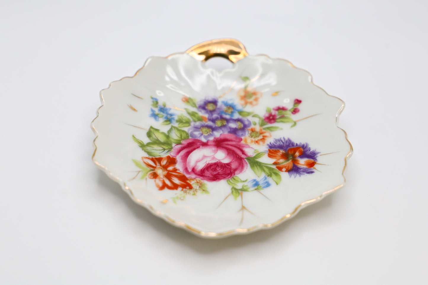 Delicate leaf shaped dish, with floral motif.
