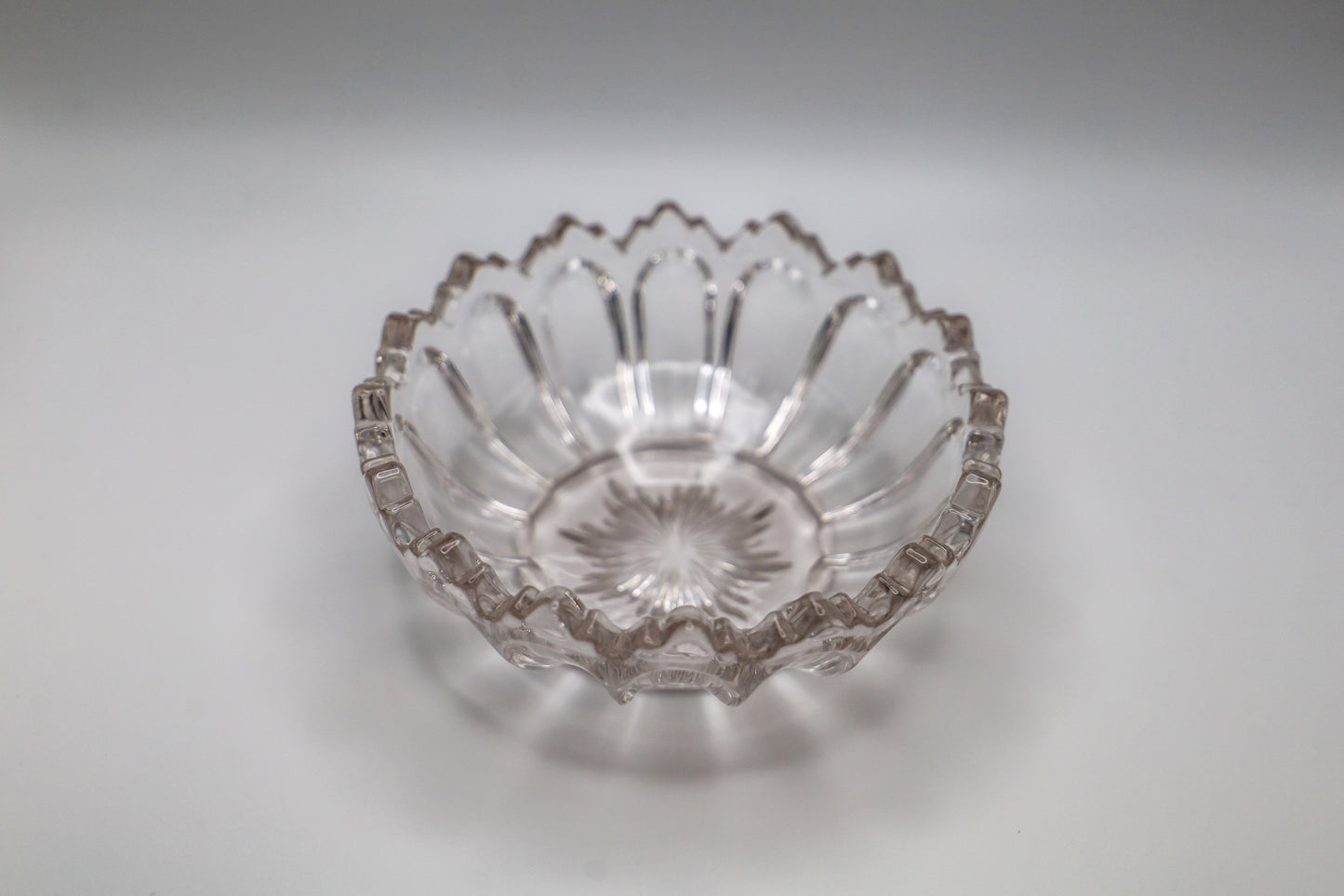Small cut glass fruit bowl, including a nice starburst pattern in the bottom and the shape of the sides is reminiscent of Moroccan design