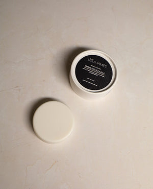 Shave Butter Bar sitting next to packaging.