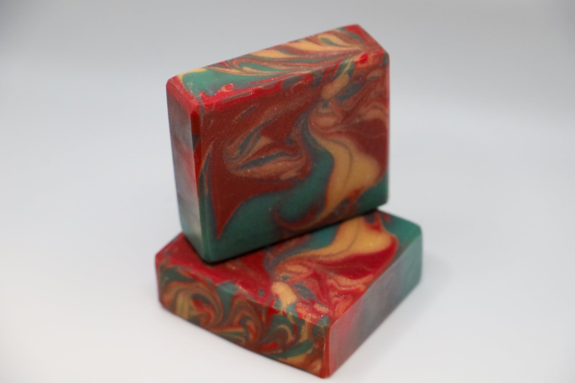 Red Green and Gold handmade swirled soap in Lingonberry Scent