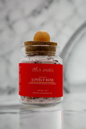 Marble background, lovely rose bath salts with bamboo spoon