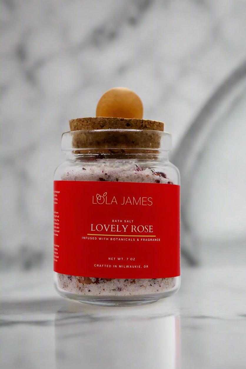 Marble background, lovely rose bath salts with bamboo spoon