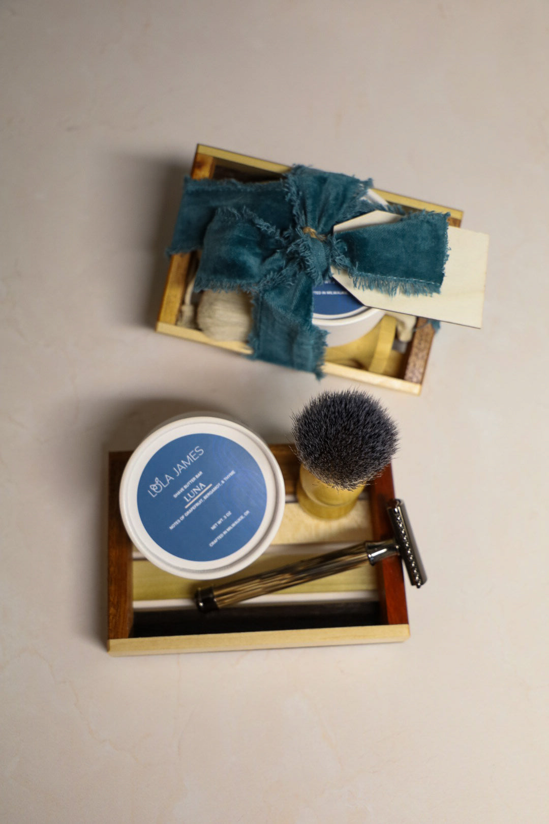 Bamboo razor, shave brush, and Luna shave bar in a wooden tray