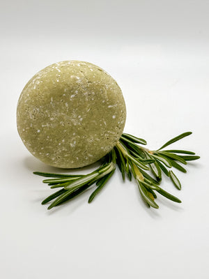 Rosemary Lavender shampoo bar with a sprig of rosemary