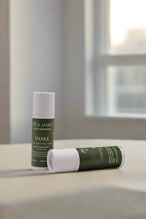 2 tubes of solid fragrance with green labels