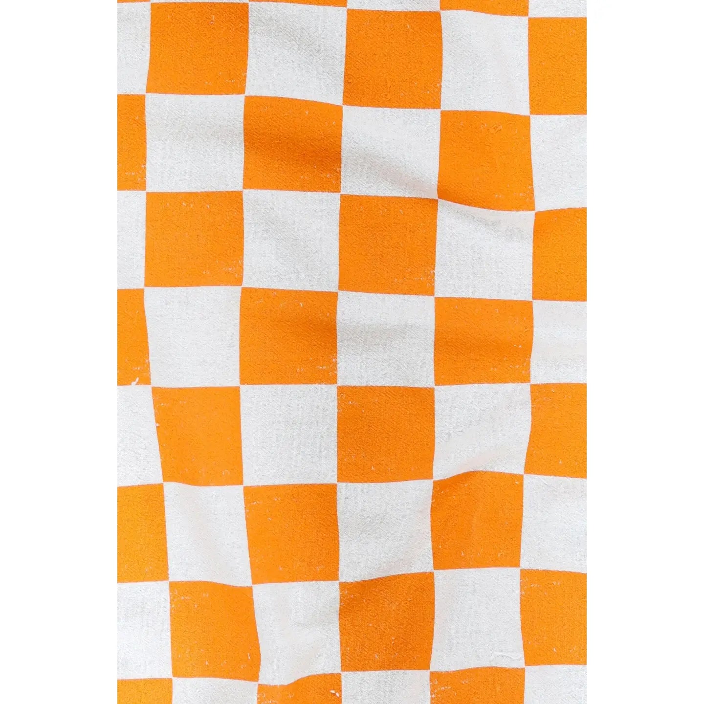 White and orange checkered tea towel.