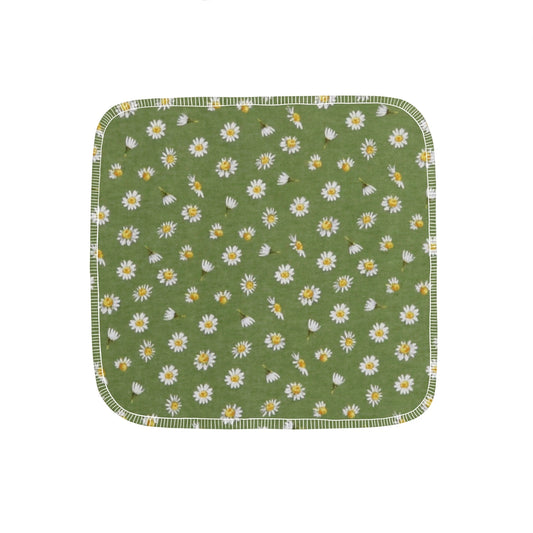 Reusable paper towel with green background and daisy flowers throughout.