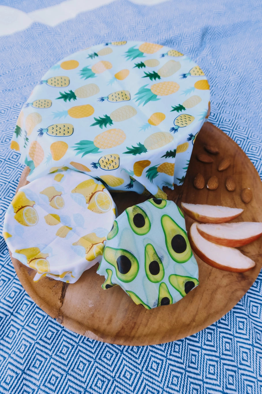 Blue patterned blanket with bowls covered in wax wrap